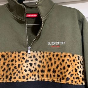 Supreme Leopard panel half-zip sweatshirt.